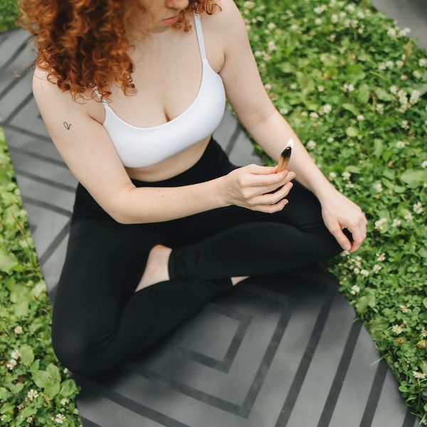 A serene outdoor scene with yoga mats, suggesting peace and tranquility.